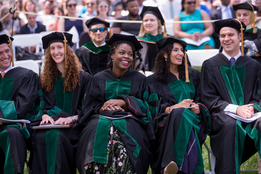 A group of CMSRU graduates featured in their regalia at a CMSRU Commencement ceremony.