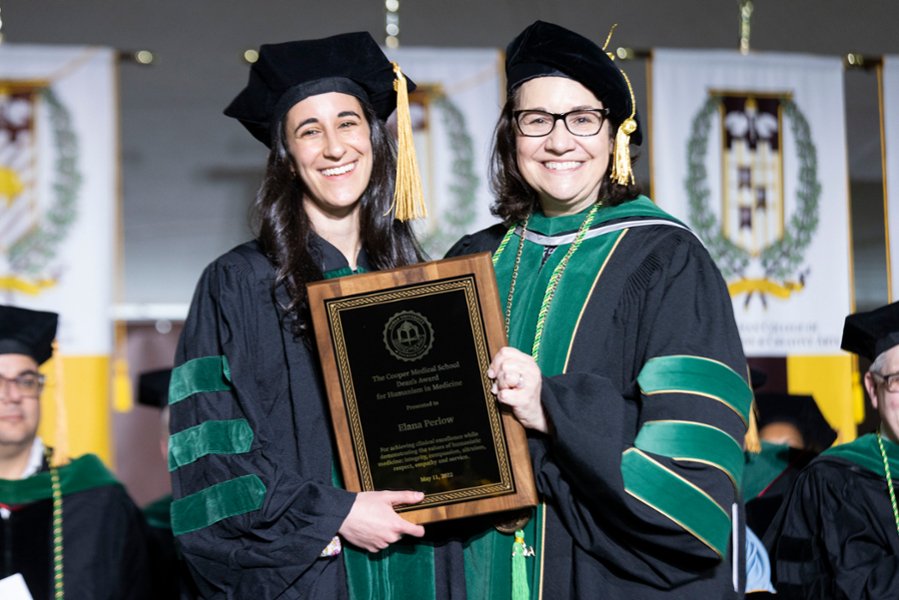Annette C. Reboli, MD, poses for a photo with a graduate at a recent CMSRU Commencement ceremony.