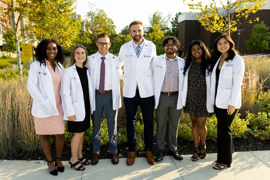 A group of CMSRU students pose for a photo at a CMSRU White Coat Ceremony.
