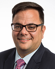 A headshot photo featuring Anthony J. Mazzarelli, MD, JD, MBE, associate dean for clinical affairs at CMSRU.