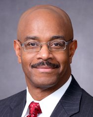 A headshot photo featuring Guy Hewlett, MD, FACOG, associate dean for diversity and community affairs at CMSRU.