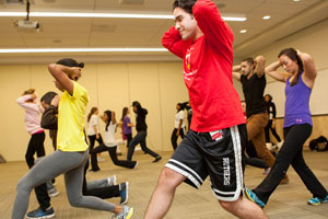 A photo of CMSRU students leading the "Healthy Habits-Health Community" event while exercising.