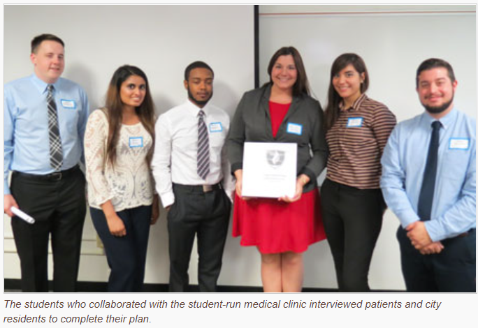 The group of students who collaborated with the student-run medical clinic interviewed patients and city residents to complete their plan. 