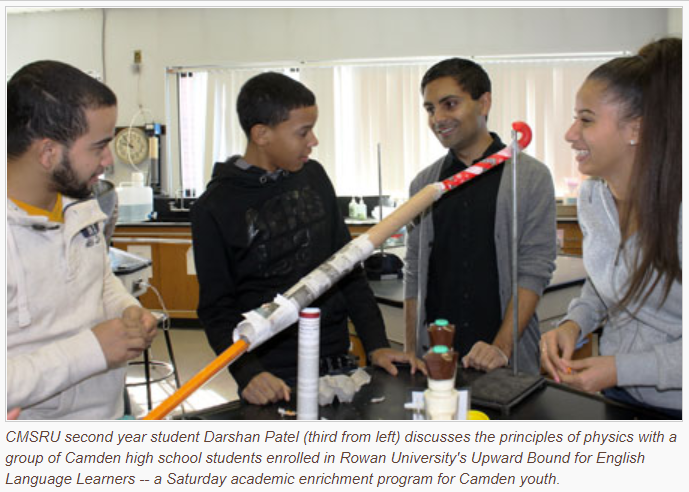 Darshan Patel (second-year student at CMSRU), discusses the principles of physics with a group of Camden high school students enrolled in Rowan University's Upward Bound for English language learners - a Saturday academic enrichment program for Camden youth.