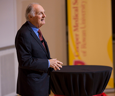 Alan Alda is shown speaking to the audience at special event at CMSRU.