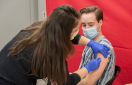 A CMSRU student receives the COVID-19 vaccine.