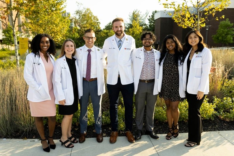 This photo features a group of CMSRU students in their White Coats.