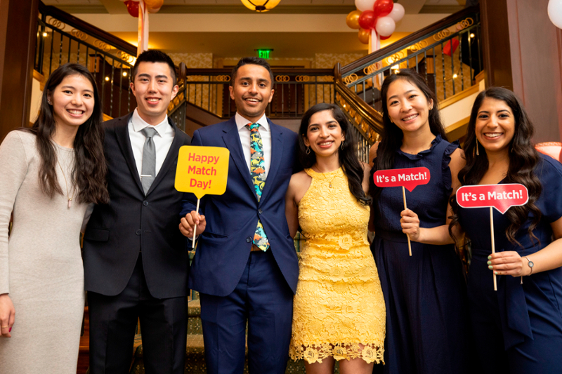 A photo of CMSRU students pose together for a photo at CMSRU's Match Day Celebration.