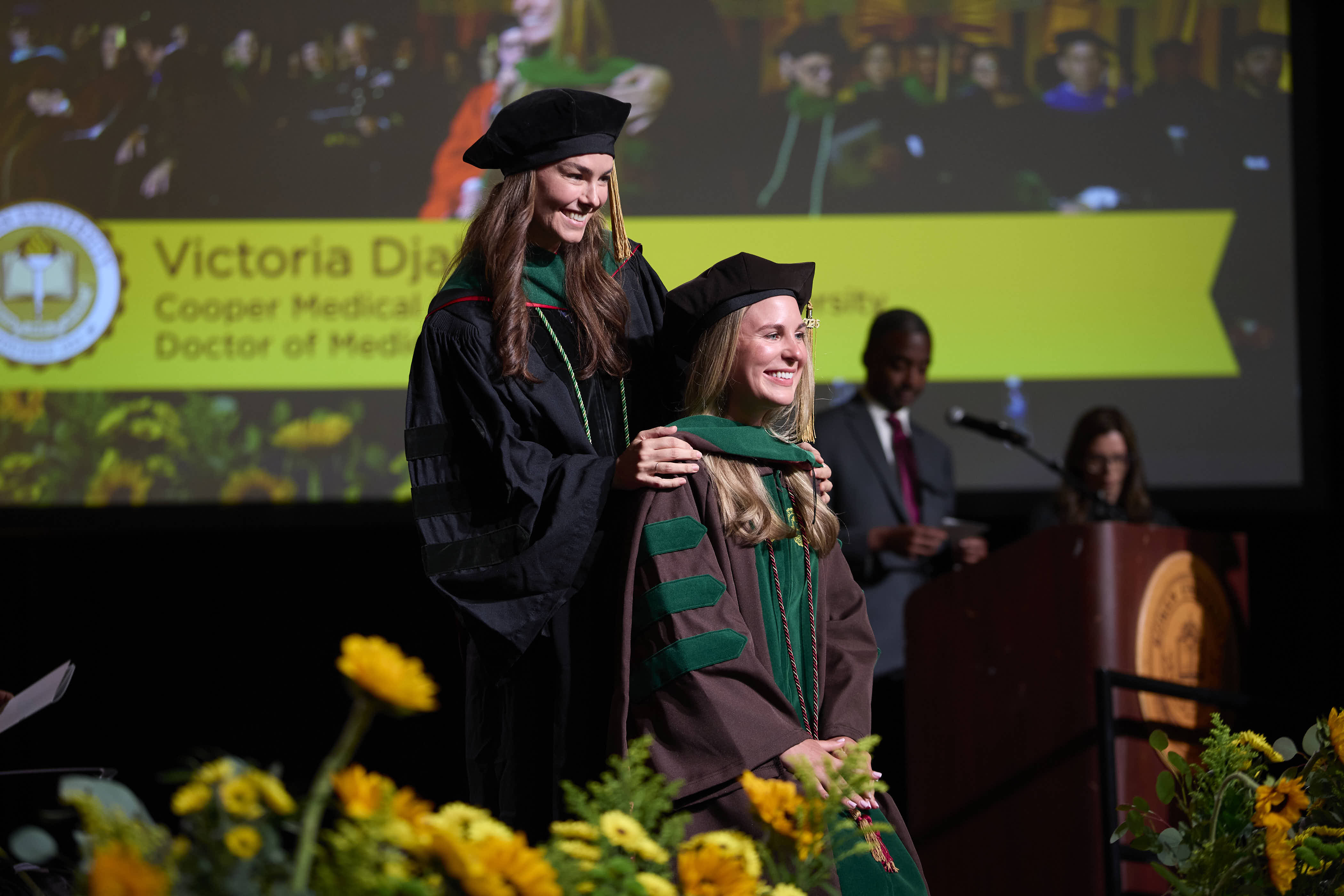 A student receiving her hooding during the 2026 Commencement ceremony