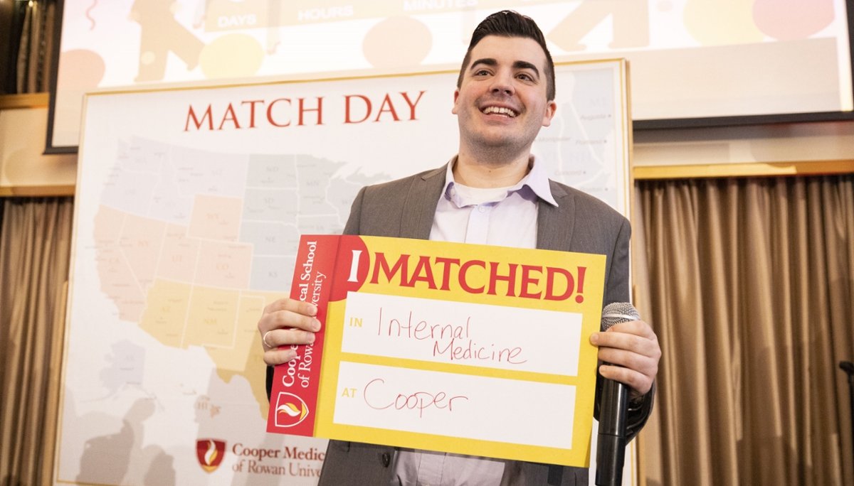 A CMSRU student holds up a sign to showcase their Match at CMSRU's Match Day celebration. Match Day is the day when the National Resident Matching Program releases results to applicants seeking residency and fellowship training positions in the United States.