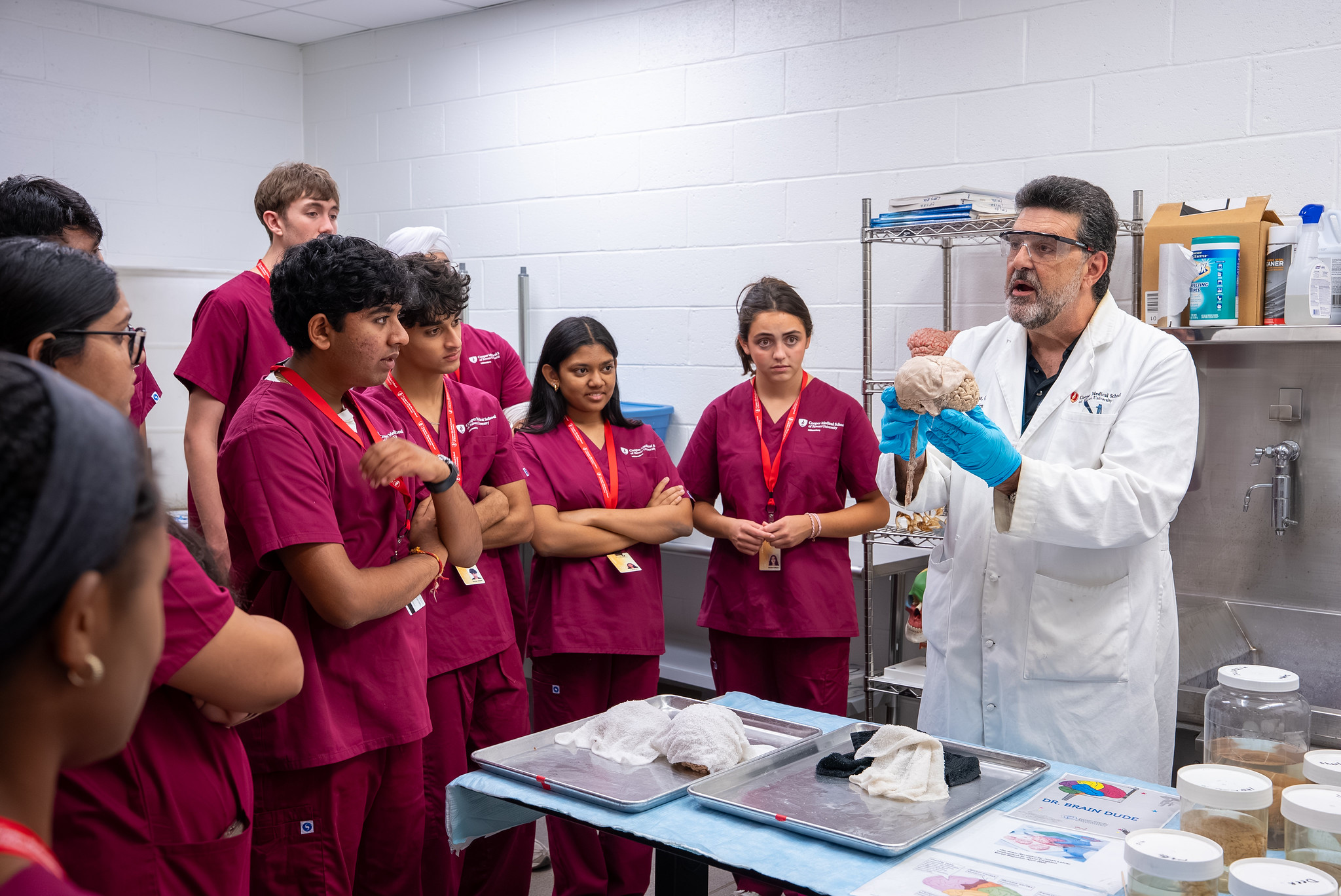 A CMSRU faculty member speaks with a group of students participating in the MEDacademy program.