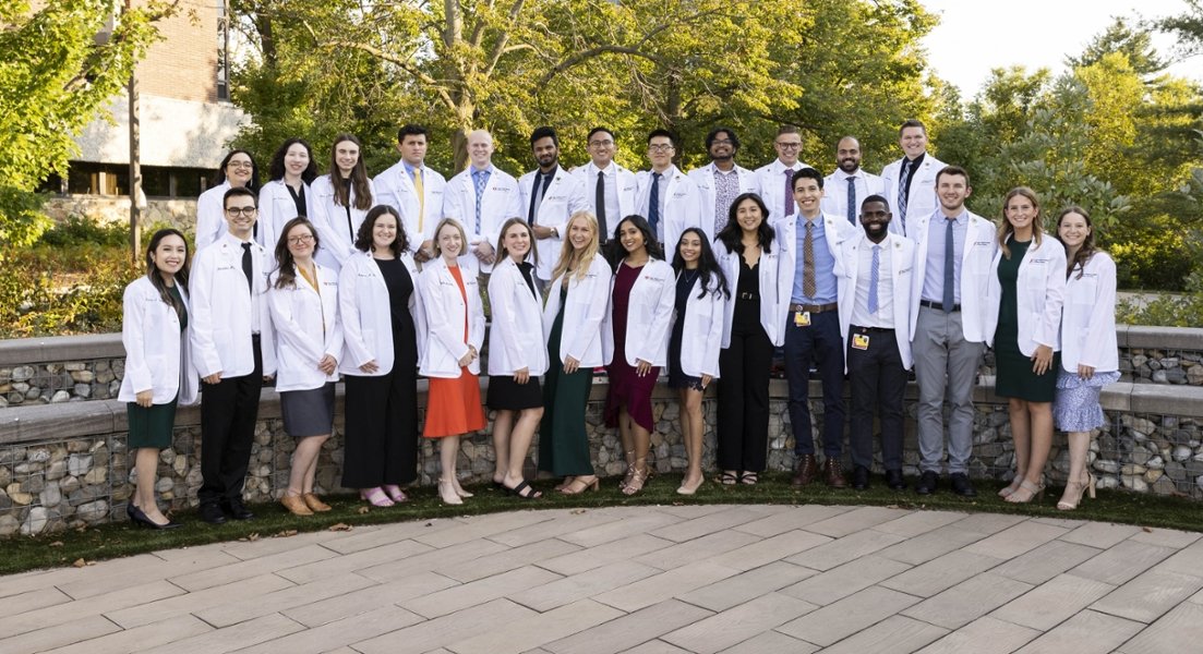 A photo of CMSRU from CMSRU's Class of 2026 pose for a photo at their White Coat Ceremony.