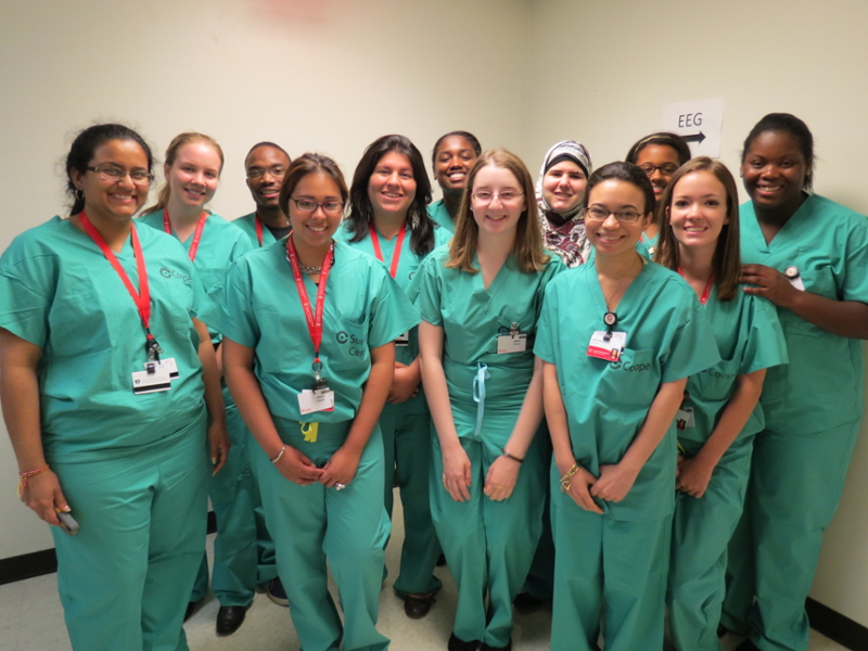 Image of 12 students from a community outreach program at CMSRU. This group is diverse in gender, race and culture.