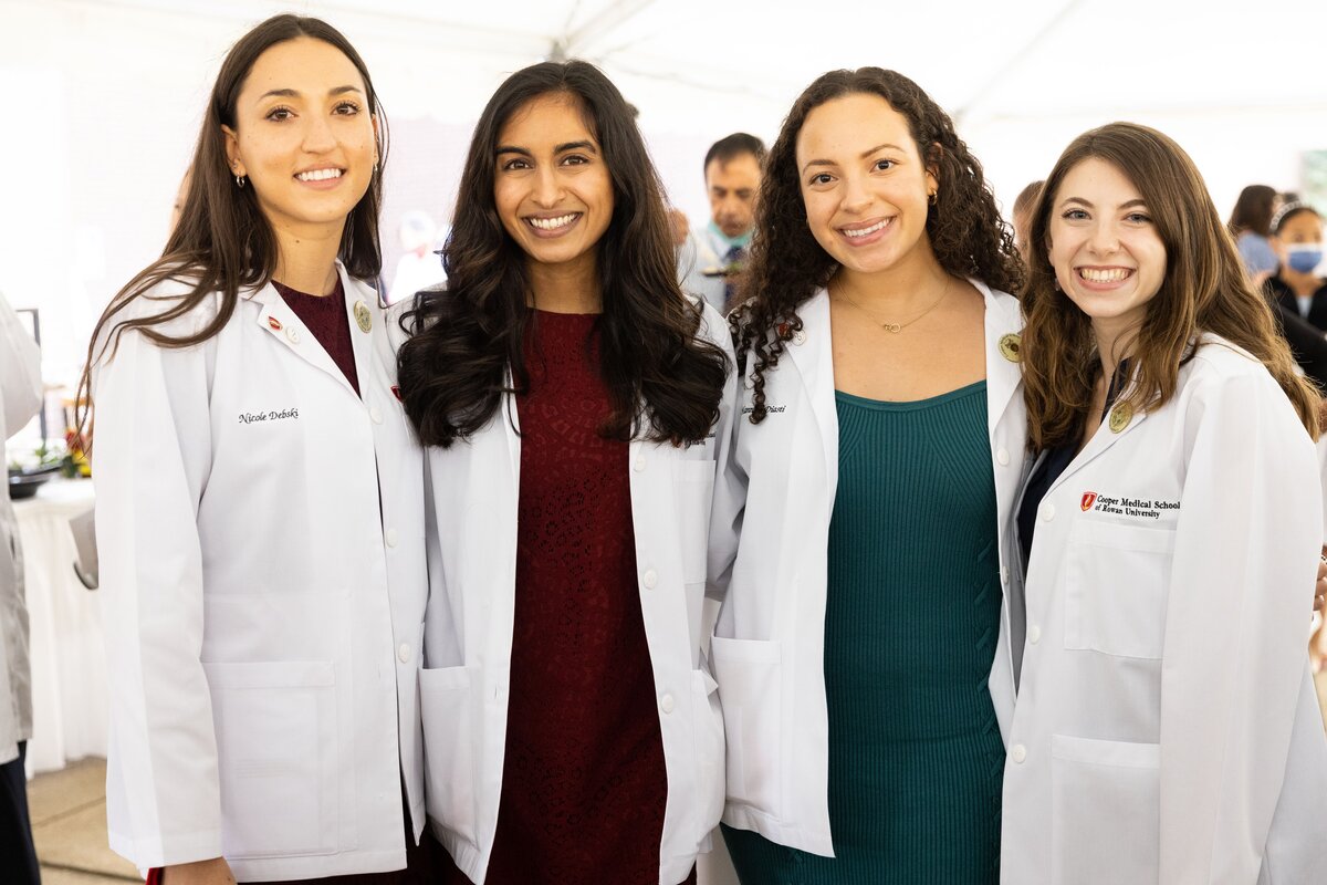 A group of CMSRU students pose for a photo at the White Coat Ceremony.