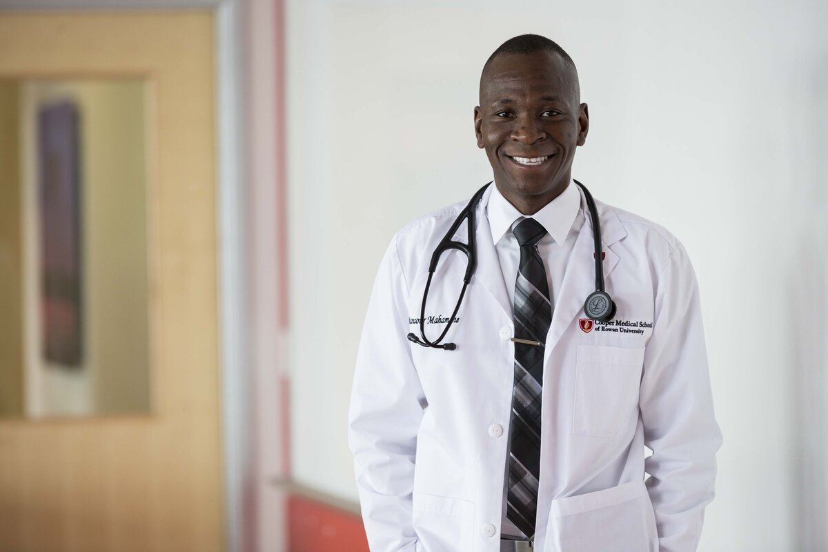 A photo of a CMSRU student in their CMSRU White Coat. 