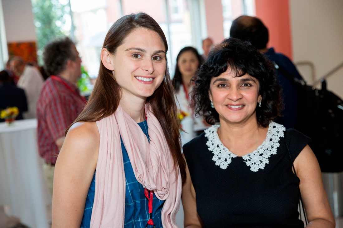Two CMSRU faculty members pose for a photo with each other at a faculty event.